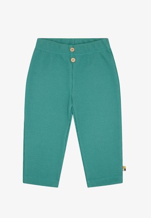 Pantaloni in cotone turchese con un motivo a nido d'ape, dotati di due bottoni in legno in vita e di una piccola etichetta sul lato.
