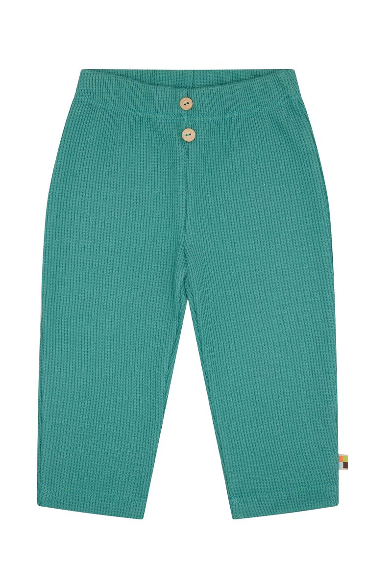 Pantaloni in cotone turchese con un motivo a nido d'ape, dotati di due bottoni in legno in vita e di una piccola etichetta sul lato.