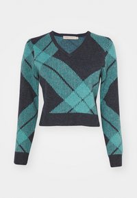 Marineblå genser med V-hals, med et geometrisk mønster i teal og mørkeblå. Lange ermer og en kort design med stripede detaljer.