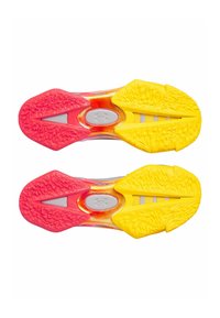 Athletic shoe outsole featuring red and yellow rubber traction, textured patterns, and a central silver accent, designed for grip and performance.