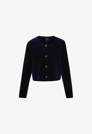 Marineblå fløjl cropped jakke med lange ærmer, rund halsudskæring, to forlommer og fem guldtonede knapper. Glat tekstur.