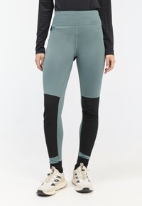 Hoge taille leggings in een mix van teal en zwart, met een gladde textuur, een strakke pasvorm en een zijzakje.