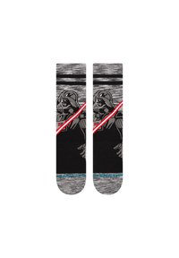 Calcetines negros con acentos grises en los dedos y el talón, que presentan un sable de luz rojo y un diseño gráfico de un personaje con casco. Material de punto suave.