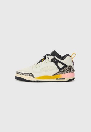Sneaker with a cream upper, black accents, and patterned gray midsole. Features yellow and pink details with black rubber outsole.