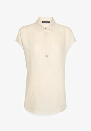 Blusa sin mangas color beige con cuello puntiagudo y dos botones visibles sobre un fondo liso.