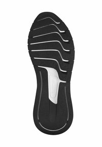 Suola di scarpa nera con scanalature e rilievi curvi, caratterizzata da una sezione centrale bianca. Superficie testurizzata per aderenza e flessibilità.