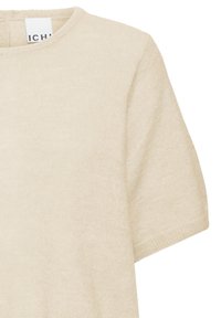 Beige short-sleeve crewneck sweater with a soft knit texture and visible brand label at the neckline.