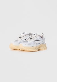 White mesh sneakers with a textured design, grey accents, and a beige rubber sole. Features laces and a pull tab at the back.