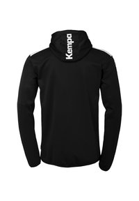 Zwarte hoodie met lange mouwen, voorzien van een wit logo op de rug en witte accenten op de schouders. Glad, zacht materiaal.