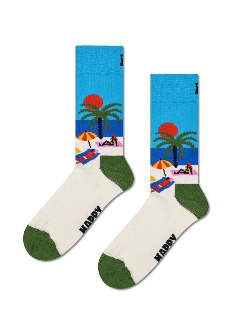 Bunte Socken mit einem Strandszenen-Motiv, das Palmen, Sonnenschirme und Sonne zeigt. Blaues Oberteil, weißer Körper, grüne Fersenelemente und Zehenakzente.