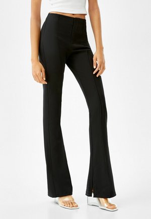 WITH SPLIT HEMS - Pantaloni - black