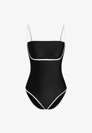 Maillot de bain une pièce noir avec fines bretelles blanches et bordure blanche soulignant la poitrine et les ouvertures des jambes.
