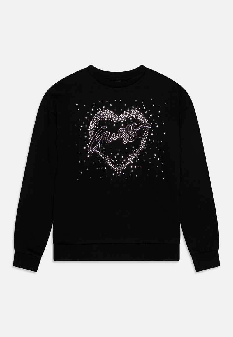 Sweat-shirt noir à manches longues avec un cœur scintillant composé de points blancs et le mot « Guess » en écriture cursive à l’intérieur du cœur sur le devant.