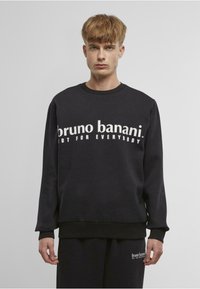Černá mikina s výrazným bílým textem "bruno banani NOT FOR EVERYBODY", s žebrovanými manžetami a páskem, vyrobená z měkkého materiálu.
