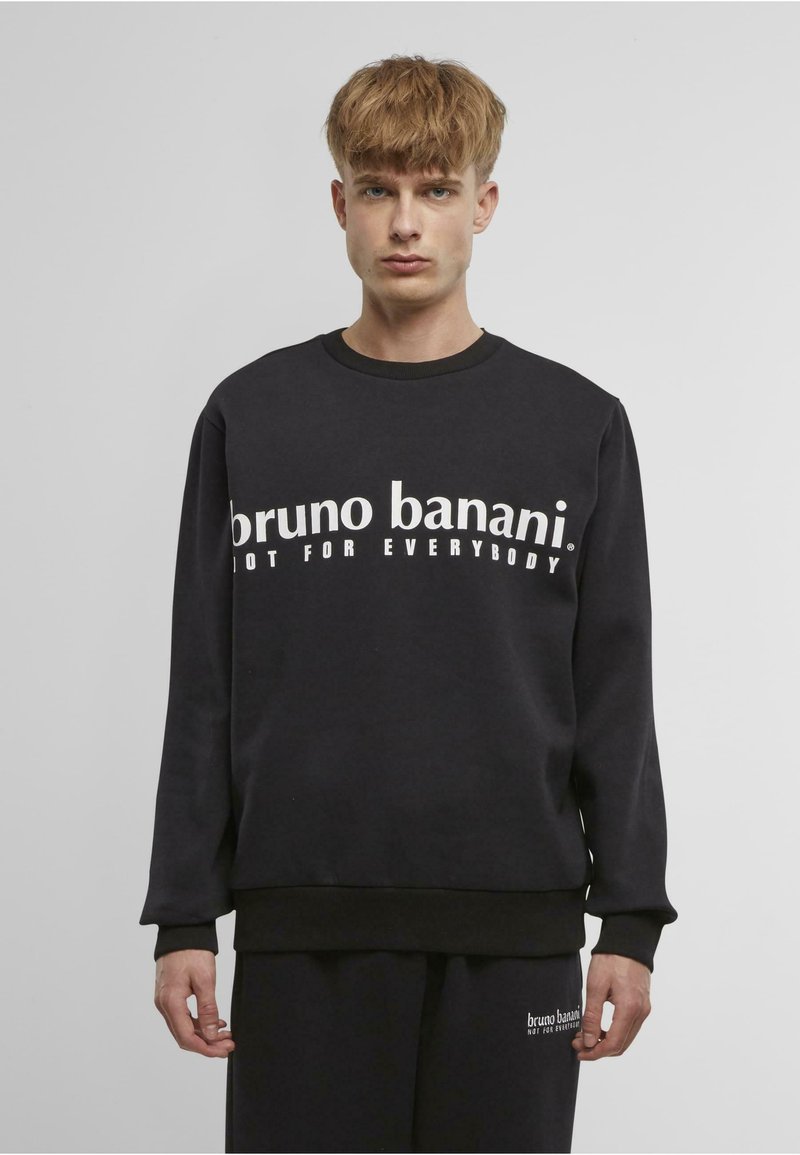 Černá mikina s výrazným bílým textem "bruno banani NOT FOR EVERYBODY", s žebrovanými manžetami a páskem, vyrobená z měkkého materiálu.