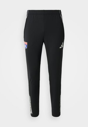Schwarze Sporthosen im Slim Fit. Mit grauem Adidas-Logo an den Seiten und buntem Teamemblem auf der Vorderseite. Hergestellt aus glattem, dehnbarem Material.