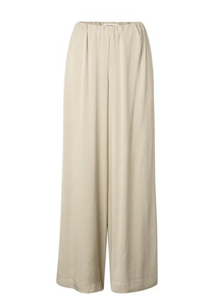 Pantalon beige ample à jambes larges avec taille élastique et plis subtils à l'avant, présenté sur un fond blanc.