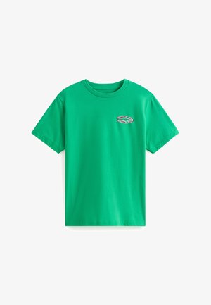 Grünes Baumwoll-T-Shirt mit Rundhalsausschnitt. Mit einem kleinen, gestickten Logo auf der Brust. Kurze Ärmel und reguläre Passform.