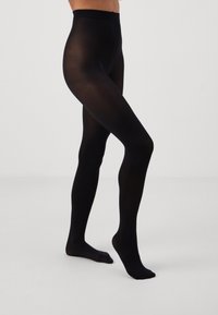 Black opaque tights made of nylon. Smooth texture with a high waistband and without any visible patterns or embellishments.