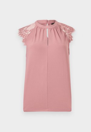 Blusa rosa sin mangas con detalles de encaje en los hombros, abertura en forma de ojo de cerradura en el escote y textura de tela suave.