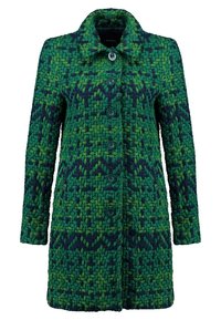 Manteau tricoté vert et bleu marine avec une fermeture boutonnée devant et un motif géométrique texturé.