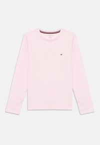 Light pink long-sleeve T-shirt made of cotton, featuring a crew neckline and a small embroidered logo on the chest. Soft texture.