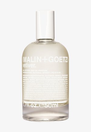 Durchsichtige Sprühflasche aus Glas mit runder Basis und leicht konisch zulaufendem Hals. Weiße Kappe. In Weiß gedruckter Text, der das Parfüm und die Inhaltsstoffe beschreibt.