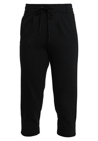 Pantalons noirs coupe courte en tissu doux, dotés d'une taille élastique avec cordon de serrage, de deux poches latérales et d'un design plissé à l'avant.