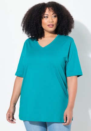 Turquoise v-neck t-shirt made of soft knit fabric. Short sleeves, relaxed fit, and smooth texture with no visible patterns or accents.