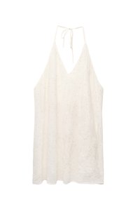 Abito halter bianco realizzato in tessuto leggero, con scollo a V profondo, lacci regolabili sul retro e decorazioni di paillettes sparse.