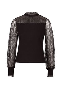 Mustat ylhäiset kaulukselliset paita, joka on täysin vartalonmyötäinen ja jossa on läpinäkyvät mustat verkko pitkät hihat, joissa on sahalaitakuvio. Tekstuurilla varustetut hihansuut, joissa on röyhelödetalji.