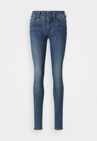 Smala jeans av blå denim med subtil blekning, traditionell femfickorsdesign, knappstängning och fållade anklar.