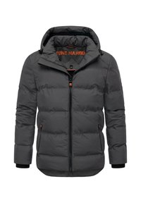 Grå pufferjacka med huva, som har en frontdragkedja och två sidofickor. Texturerat tyg med orange detaljer på insidan och dragkedjan.