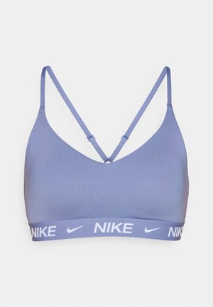 Nike sportbrasi hele lavendli tooni, sujuva tekstuuriga, reguleeritavad rihmad ja valge logo elastsel ribal. Klassikaline disain.