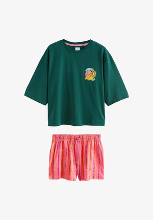 Dark green short-sleeve shirt with banana and flower graphic paired with pink and orange striped elastic waist shorts.