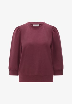 Bordowa bluza wykonana z miękkiego materiału, z okrągłym dekoltem i bufkami na rękawach, o lekko luźnym kroju i ściągaczach na mankietach.