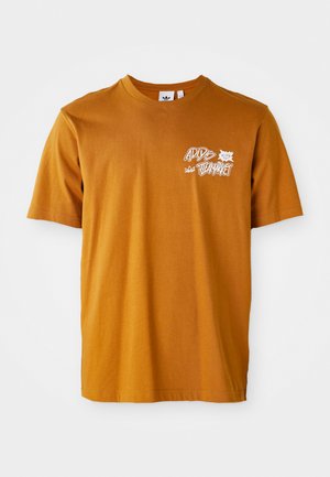 T-shirt de algodão castanho com decote redondo, mangas curtas, apresentando texto gráfico branco e design de folhas na frente.