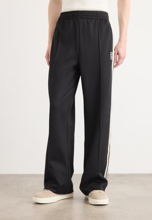 Calvin Klein STRIPE - Tracksuit bottoms - black