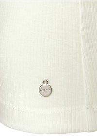 White ribbed fabric with a smooth texture, featuring a small silver logo tag at the hem. Simple, form-fitting design.