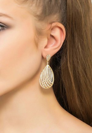 Gold-tone drop earrings with a teardrop shape, featuring intricate, spiral patterns and embedded clear crystals for sparkle.
