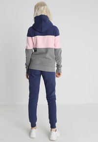 Superdry & Co Pantalones deportivos - mottled dark grey