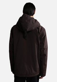 Brown, hooded jacket made of waterproof material with a relaxed fit, featuring a cinched hood and adjustable strap at the back.