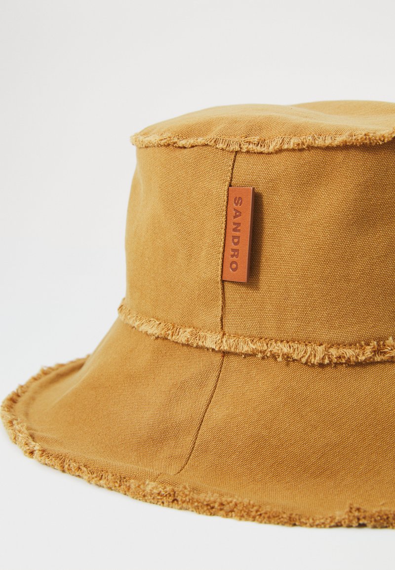 Sandro Beige cotton bucket hat featuring a Monogram Logo Sandro Cotton Frayed Bucket Hat In Beige - 40% Off  main image 4