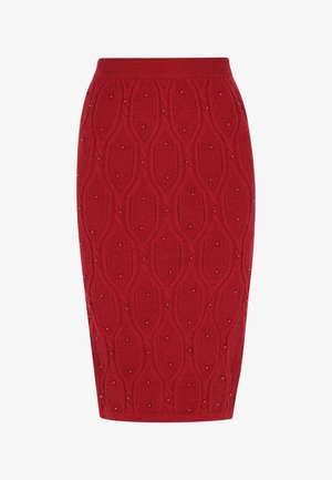 Červená pletená tužková sukně s žebrovaným pasem a vystouplými oválnými vzory zdobenými malými odpovídajícími korálky.