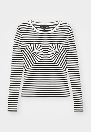 Svart- og hvitstripet langermet topp med ribbet tekstur og en sløyfe-lignende design i sentrum foran. Rund hals, tettsittende silhuett.
