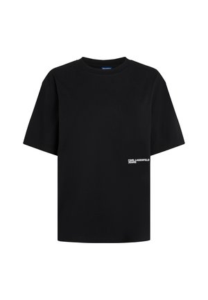 Maglietta nera a maniche corte in cotone. Presenta un collo rotondo e un piccolo testo con logo bianco sul lato anteriore sinistro.