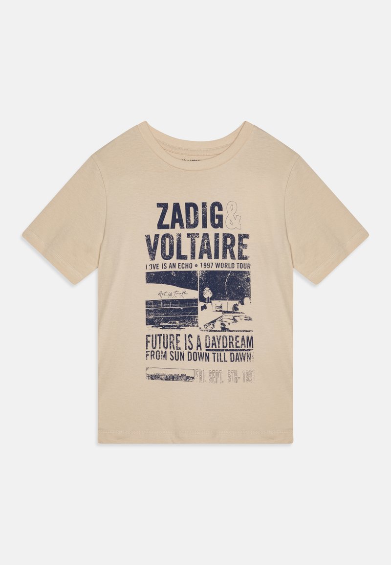 Beige cotton t-shirt with short sleeves featuring blue graphic text and images related to a concert tour, with a relaxed fit.