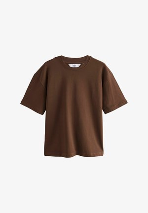 Brun kortärmad T-shirt i bomull med rund hals, avslappnad passform och slät textur. Inga synliga mönster eller accenter.