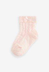 Calza lavorata a maglia rosa chiaro con polsino a costine, caratterizzata da un piccolo fiocco, un motivo a treccia testurizzato e un tessuto morbido e accogliente.