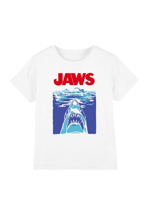 White short-sleeve t-shirt featuring a graphic of a shark with open jaws, set against a blue ocean background, and the word "JAWS" in red above.